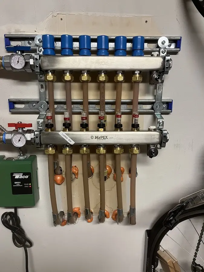 Plumber performing Water Heater Repair at a residential property in Thornapple